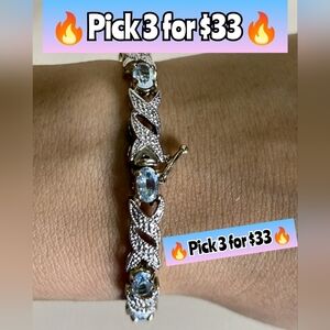 Tennis Bracelet Faceted Oval Blue Topaz, Infinity Link 7.5in